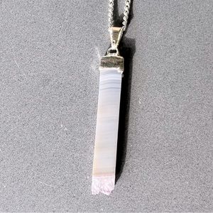 Natural stone pendant necklace on a silver plate chain